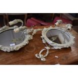 A pair of cream painted wall mounted two branch wall lights and mirrors