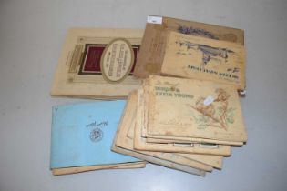 A collection of albums of various cigarette cards