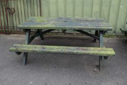 Green painted picnic bench