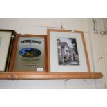 A pine framed Southern Comfort mirror together with a watercolour of a street scene, framed and