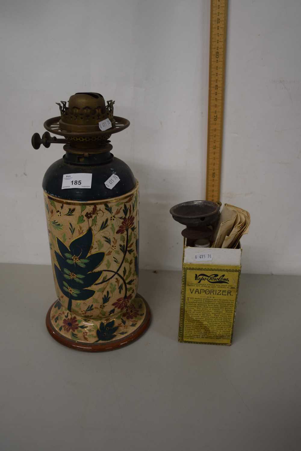 Ceramic based oil lamp together with a vintage vaporiser