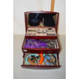 A cantilever jewellery box and various contents