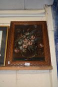 Still life study of flowers set in a carved soft wood frame