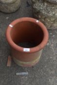 A short terracotta chimney pot, 31cm high