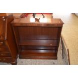 A reproduction mahogany open front bookcase cabinet