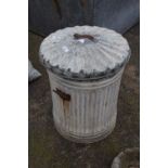 A galvanised dustbin