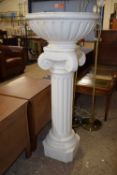 A large modern white porcelain jardiniere and stand, 130cm high