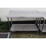 A steel kitchen preparation table, 125cm wide