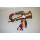 A copper and brass bugle with tassel decoration, unmarked