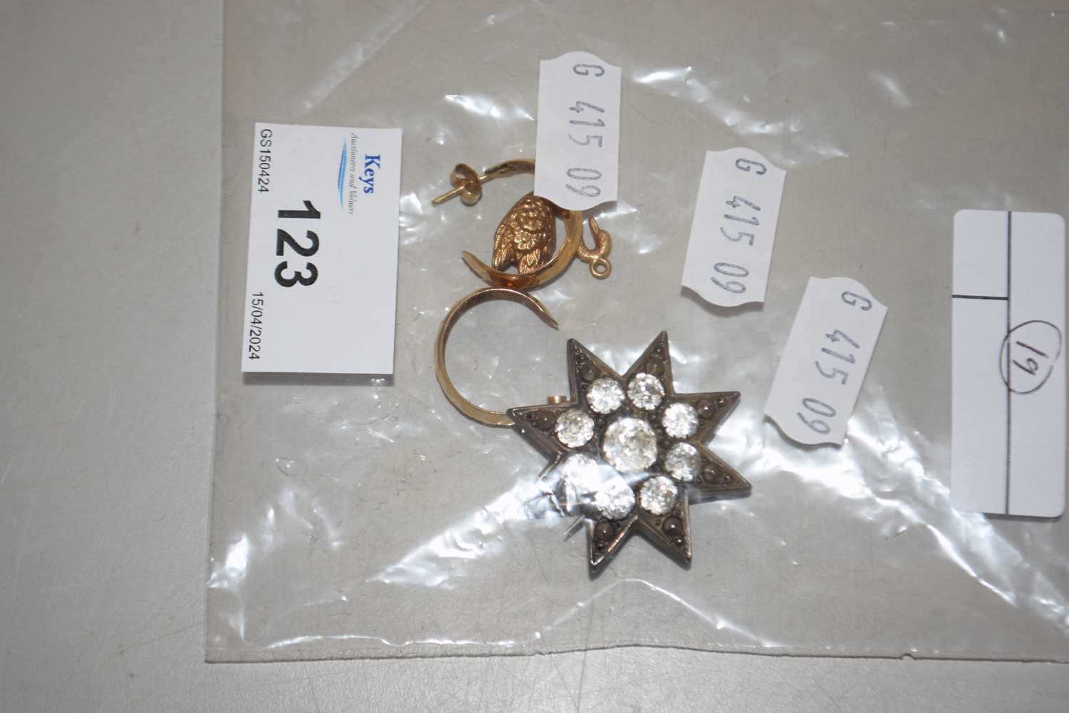 Mixed Lot: Small silver star shaped brooch together with a yellow metal swan charm and pair of