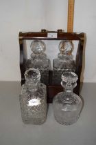 Modern two bottle tantalus together with two further decanters