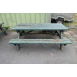 Green painted picnic bench