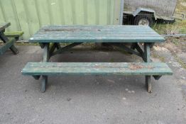 Green painted picnic bench
