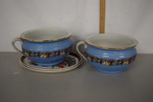 Two chamber pots and two fruit decorated serving plates