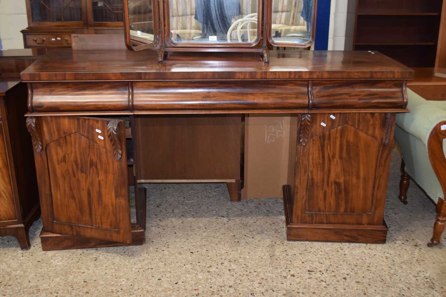 A Victorian mahogany twin pedestal sideboard