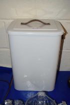 A modern enamel bread bin