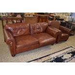 Brown leather two seater sofa and matching armchair together with a footstool (3)