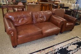 Brown leather two seater sofa and matching armchair together with a footstool (3)
