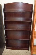A reproduction mahogany effect waterfall bookcase