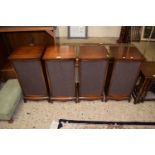 A set of four mahogany veneered speaker cabinets