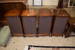 A set of four mahogany veneered speaker cabinets