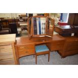 A Stag dressing table with triple mirror and stool