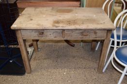 Small weathered oak two drawer writing table