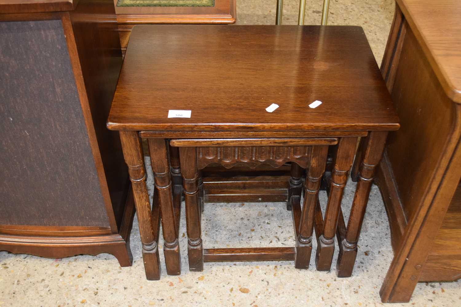 A nest of three oak occasional tables