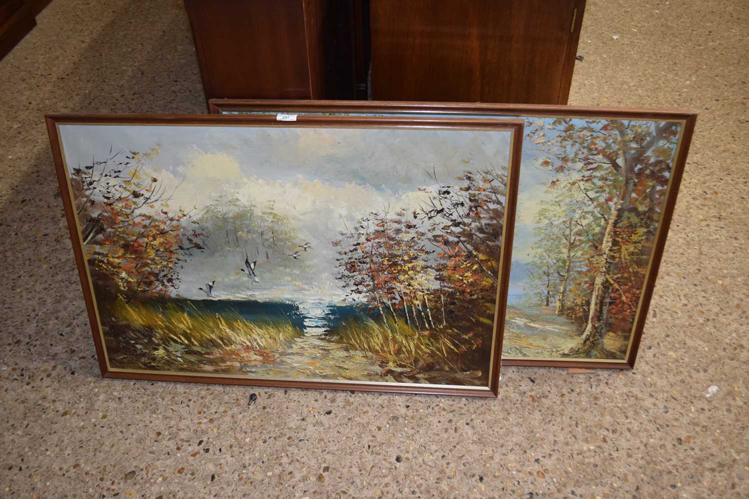 A pair of mid 20th Century oil on canvas studies of a riverside scene and a continental village