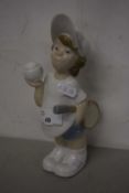 A Lladro figure of a tennis player