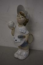 A Lladro figure of a tennis player