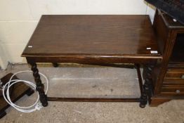 An oak side table on barley twist legs