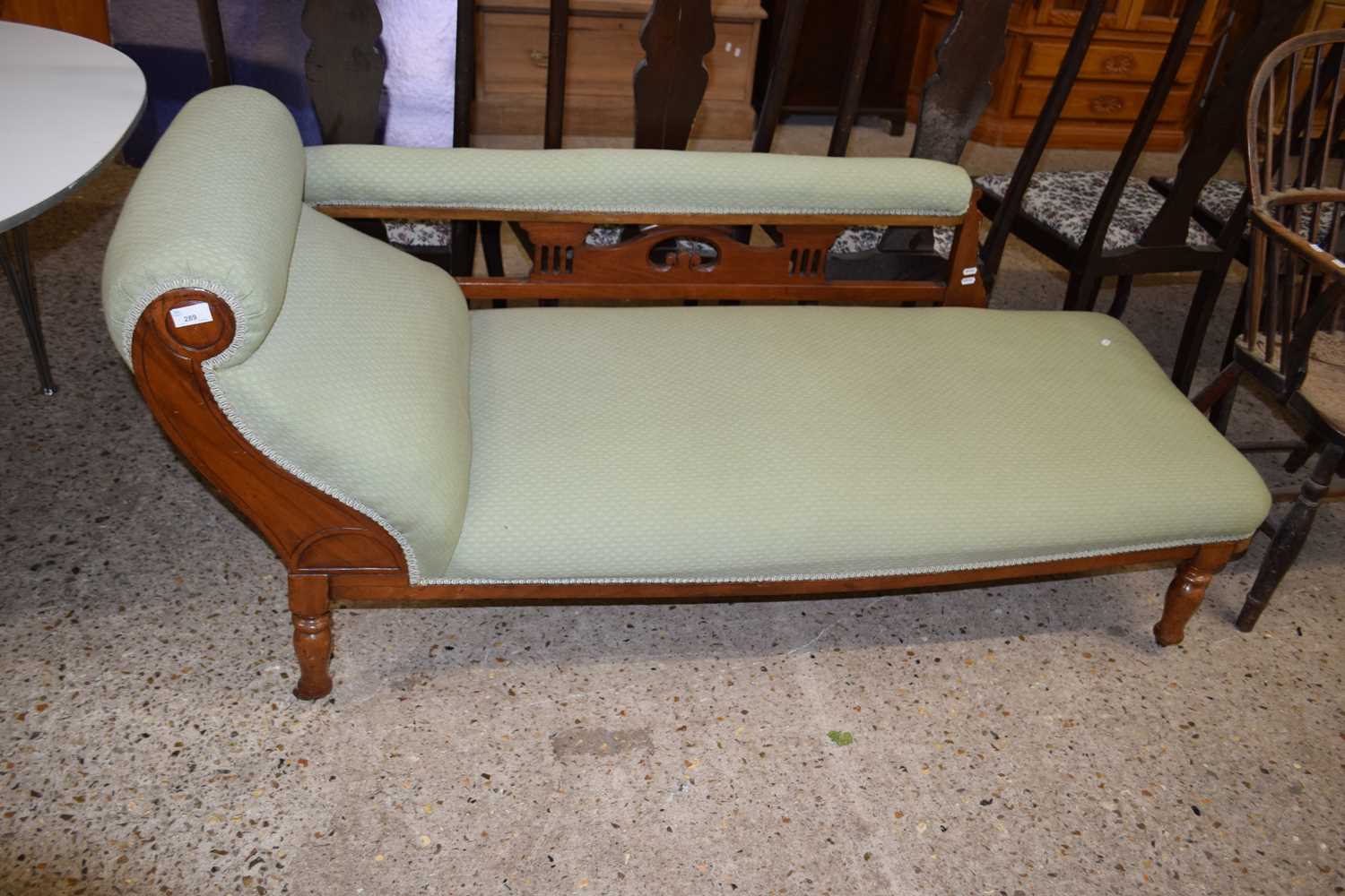 A late Victorian pale green upholstered chaise longue
