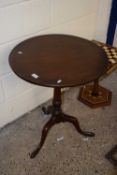 A 19th Century mahogany table with circular top, turned column and tripod base