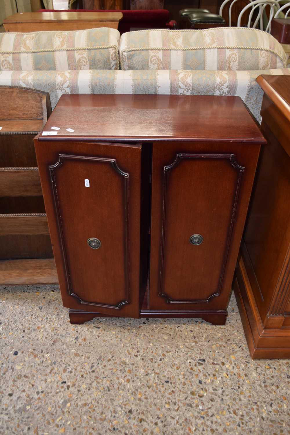 A small mahogany two door bookcase cabinet