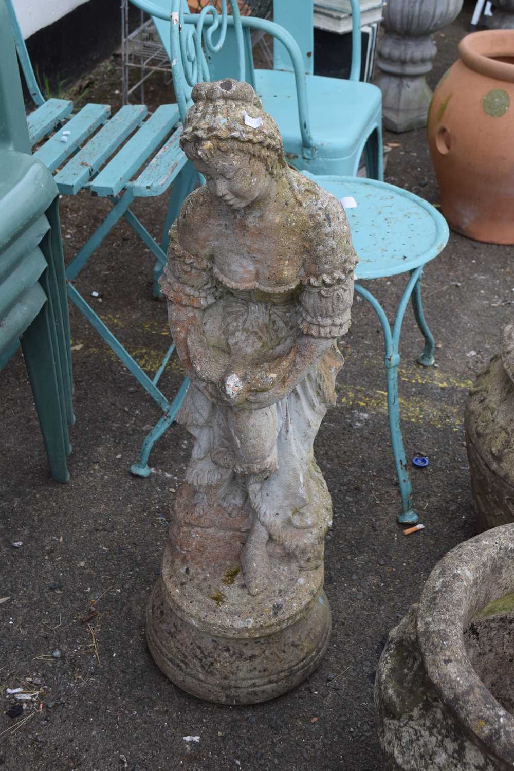 Concrete statue of a lady holding a bird, 85cm high