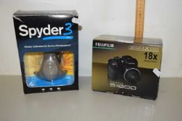 A Fuji Film S1800 camera together with a Spyder display calibrator