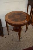 An Edwardian circular inlaid two tier centre table on tapering legs
