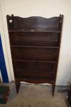 An early 20th Century open front bookcase cabinet