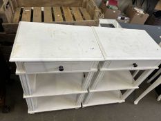 A pair of three tier single drawer night stands