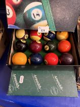 Two boxes of pool and snooker balls
