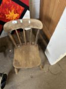 A child's pine stick back chair
