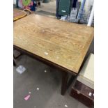 An oak extending dining table