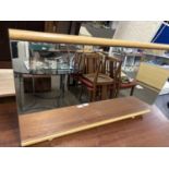 A rectangular dressing table mirror