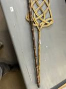A carpet beater and a walking stick
