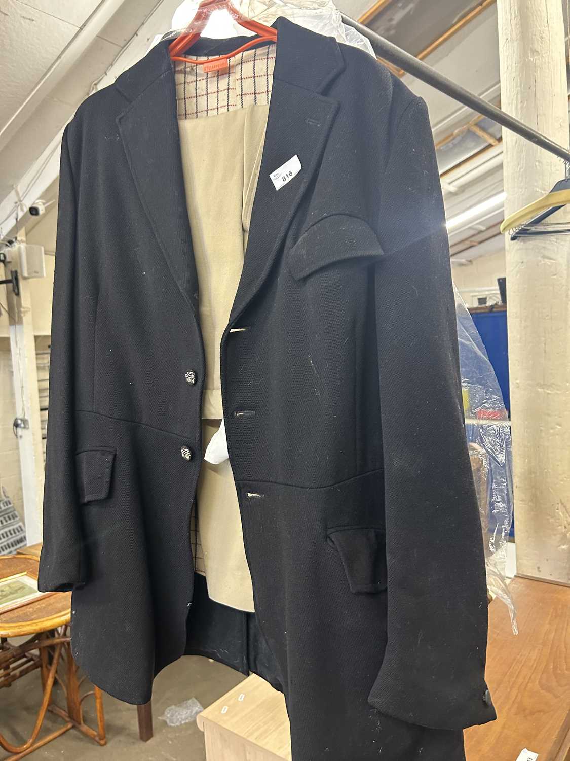 A gentlemans riding jacket and jodphurs