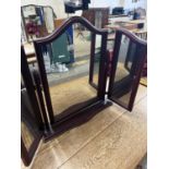 A trifold dressing table mirror