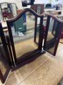 A trifold dressing table mirror