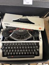 An Olympia typewriter, cased