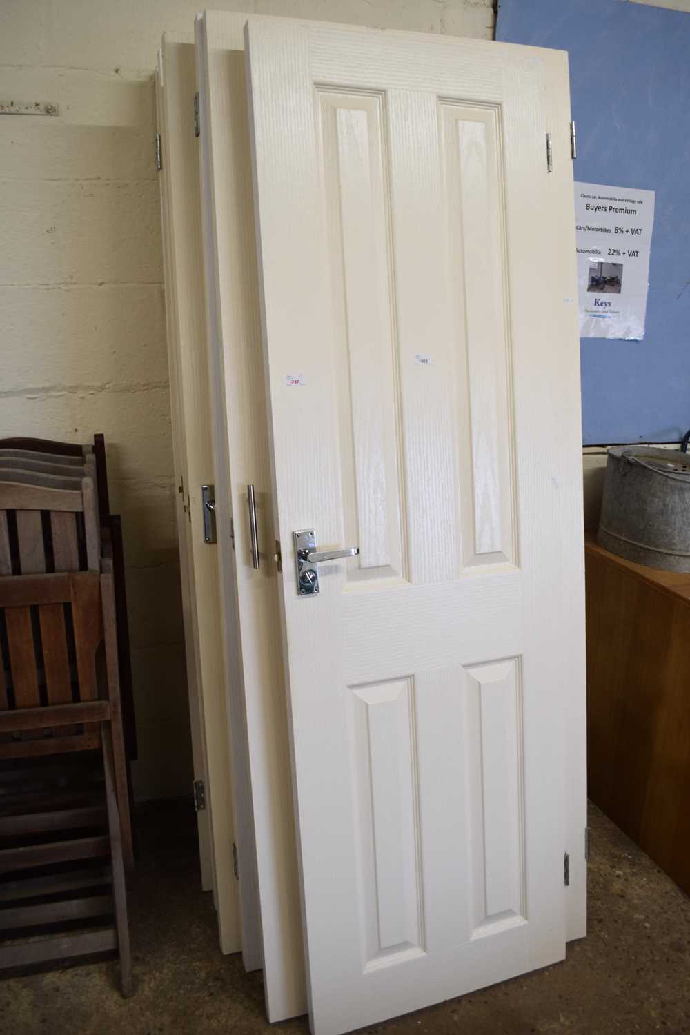 Seven cream painted wooden doors